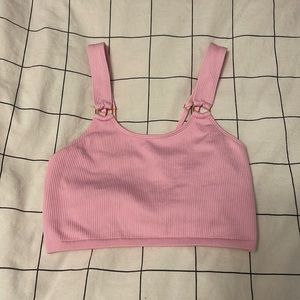 Pink ribbed cami tank top with gold hoops connecting the straps to the tank